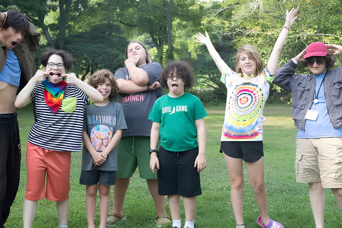 Group of happy Appel Farm campers posing outdoors
