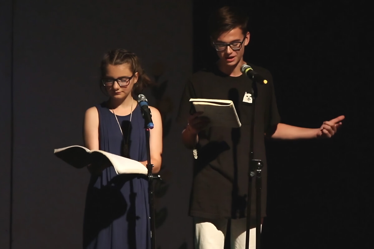 Slam poetry session with two campers reading their work onstage